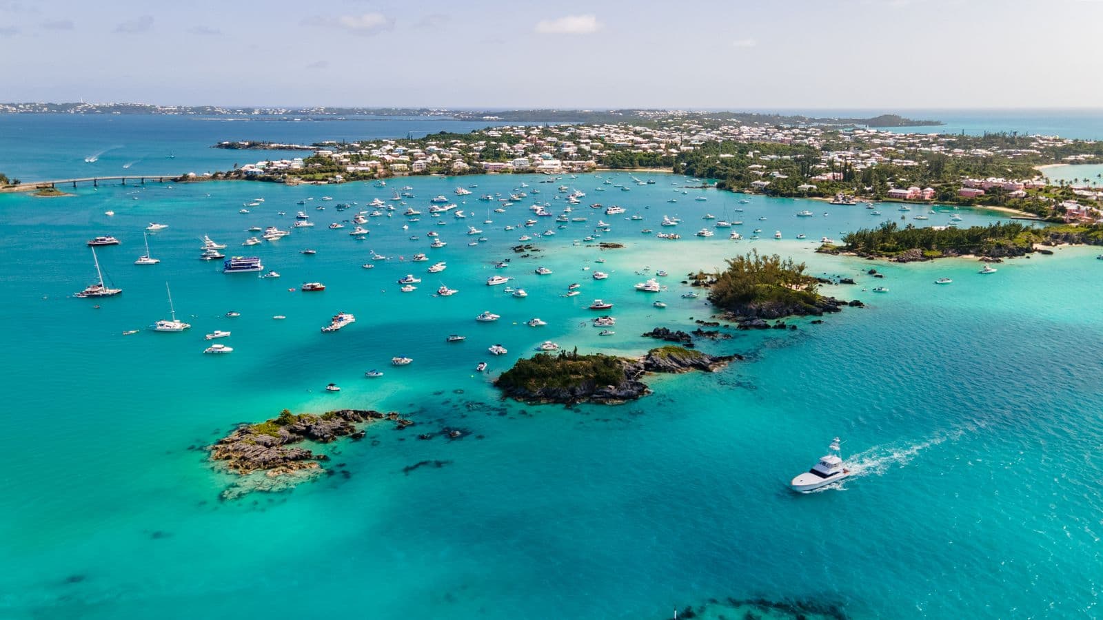 Aerial view of a Bermuda harbour dotted with boats in turquoise water