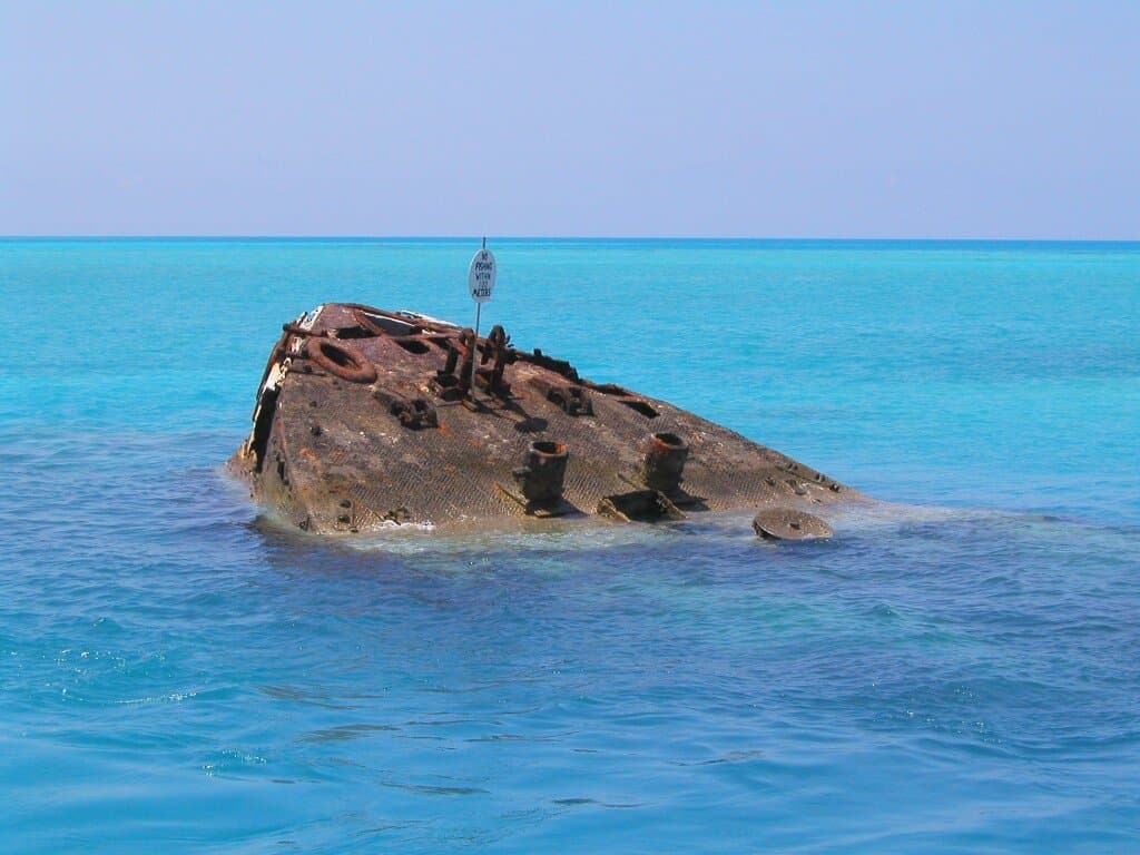 The Vixen wreck breaking the surface in shallow Bermuda water